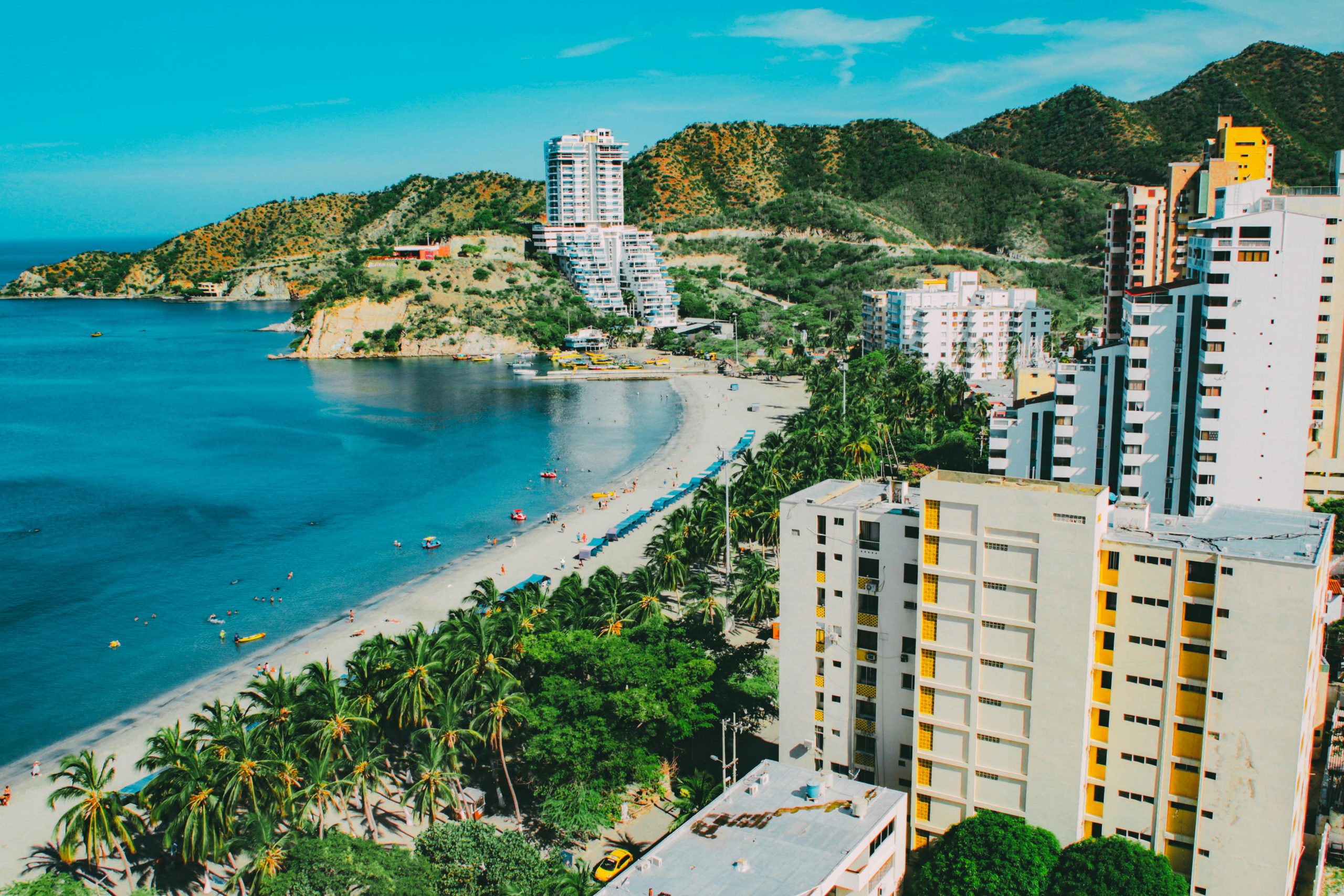 A breathtaking aerial view of Santa Marta's beachfront, showcasing a blend of nature and modern architecture.